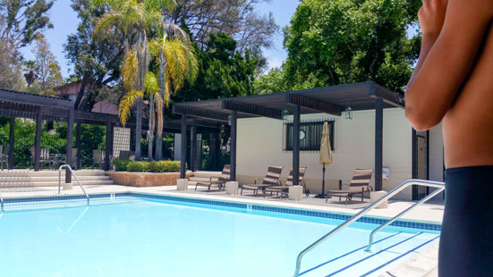 Lone Swimmer Surveying Perfectly Still Pool